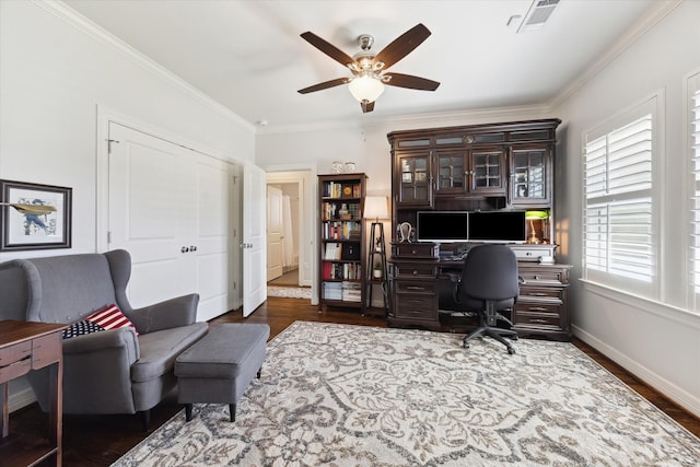 home office featuring ceiling fan, crown molding, and dark wood-type flooring