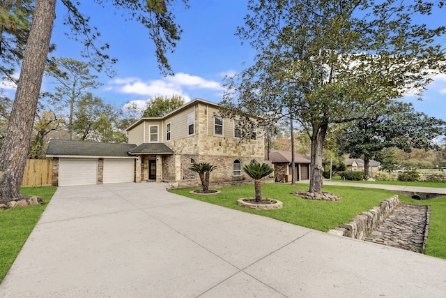 view of front of property with a garage and a front lawn