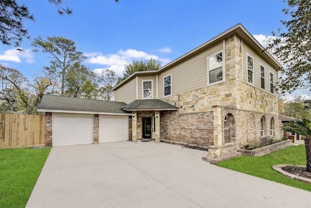 view of front of house with a garage and a front lawn