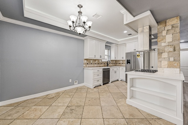 kitchen featuring appliances with stainless steel finishes, hanging light fixtures, a notable chandelier, sink, and white cabinetry