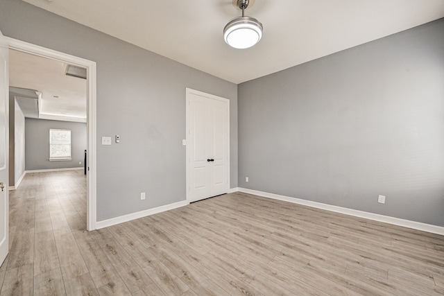 spare room with light wood-type flooring