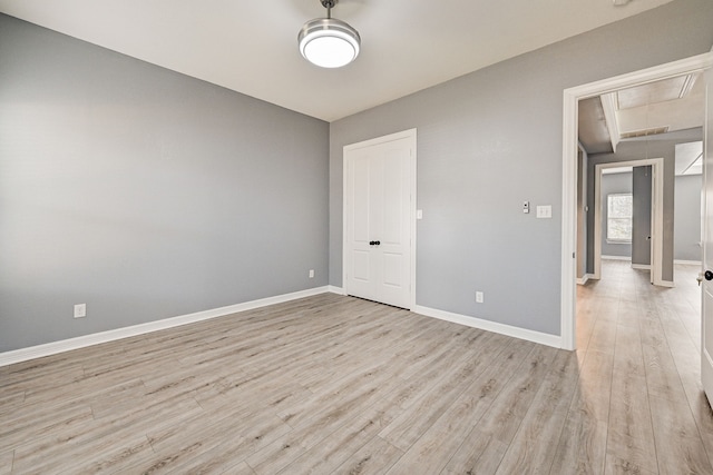 unfurnished room featuring light hardwood / wood-style floors