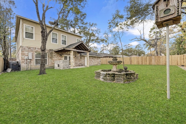 rear view of house with a lawn