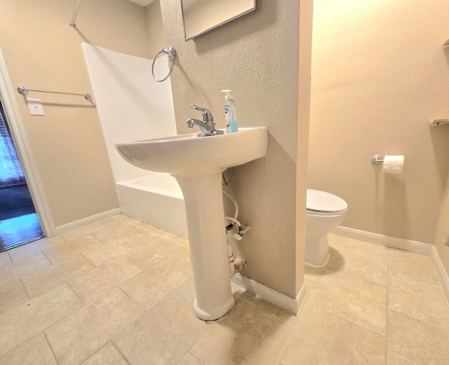 bathroom featuring toilet