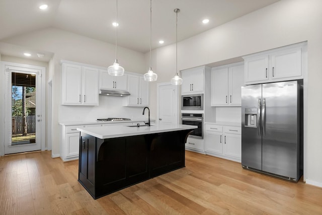 kitchen featuring sink, white cabinets, pendant lighting, and appliances with stainless steel finishes