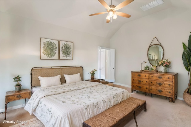 bedroom featuring lofted ceiling, ceiling fan, and light carpet