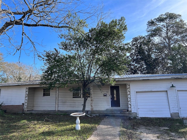 single story home featuring a garage