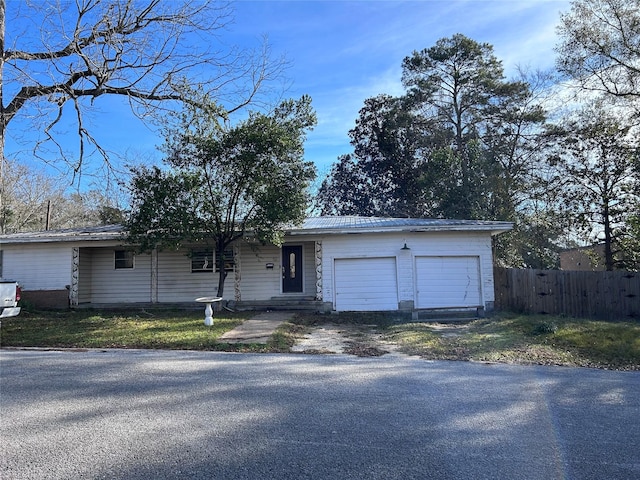 single story home featuring a garage