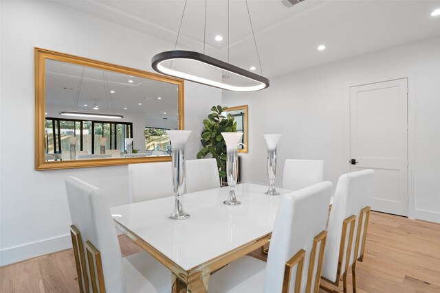 dining room with light hardwood / wood-style flooring