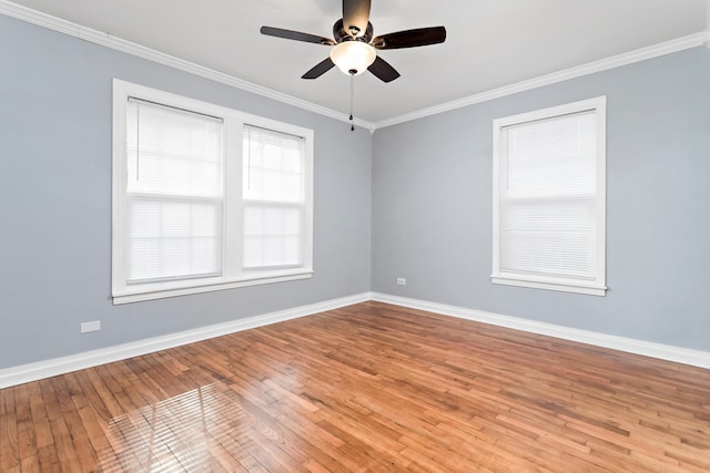 spare room with ornamental molding, ceiling fan, and wood-type flooring