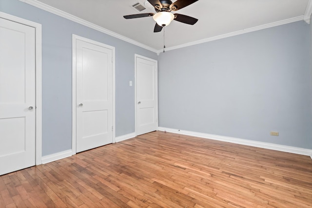 unfurnished bedroom with ceiling fan, crown molding, and light hardwood / wood-style flooring