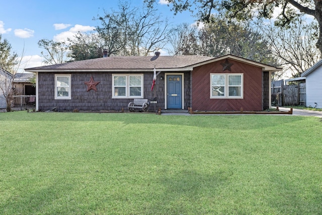 single story home featuring a front yard