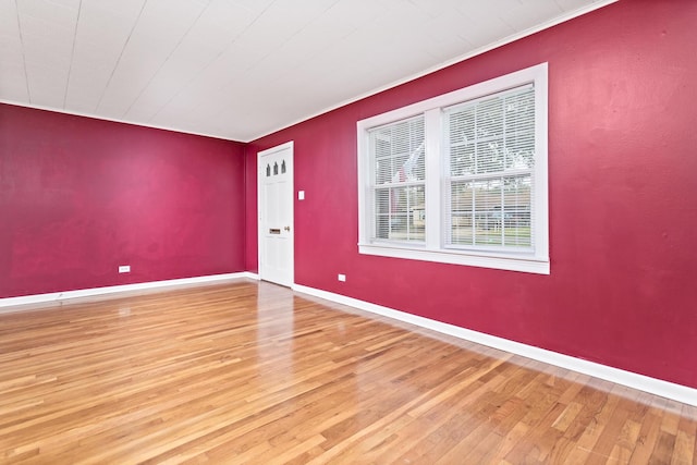 empty room with hardwood / wood-style flooring