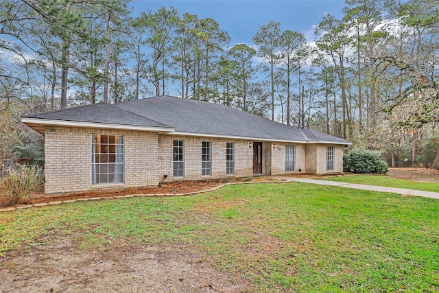 ranch-style home with a front lawn