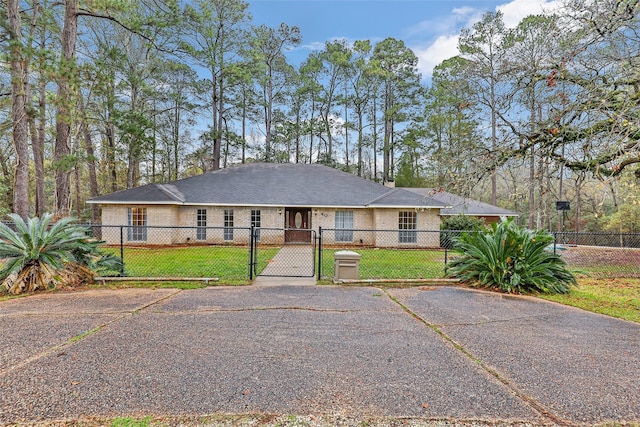 ranch-style home with a front yard