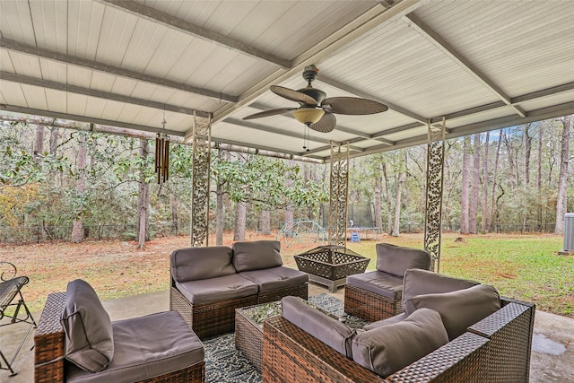 view of patio with an outdoor living space with a fire pit and ceiling fan