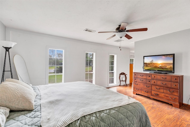 bedroom featuring ceiling fan and light wood-type flooring