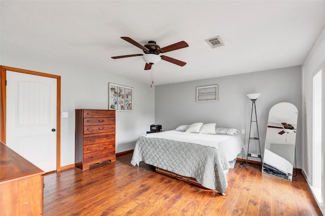 bedroom with ceiling fan and hardwood / wood-style floors