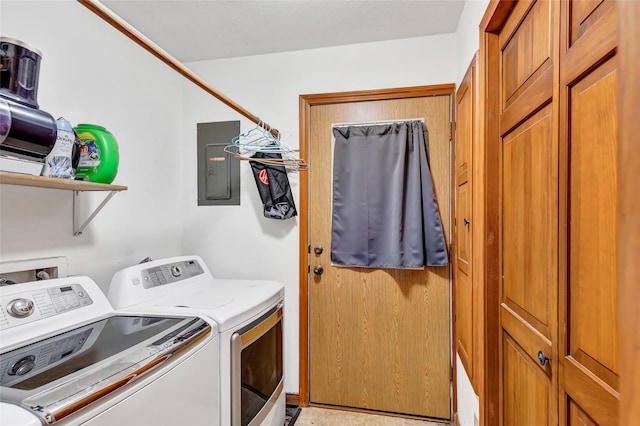 laundry area featuring washing machine and clothes dryer and electric panel