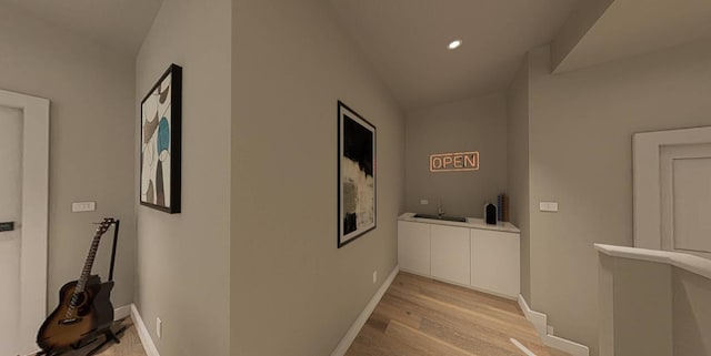 hallway with light hardwood / wood-style flooring