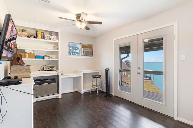 office area featuring a water view, french doors, dark hardwood / wood-style floors, and ceiling fan