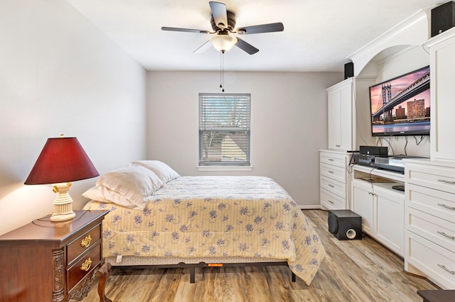 bedroom with ceiling fan and light hardwood / wood-style floors