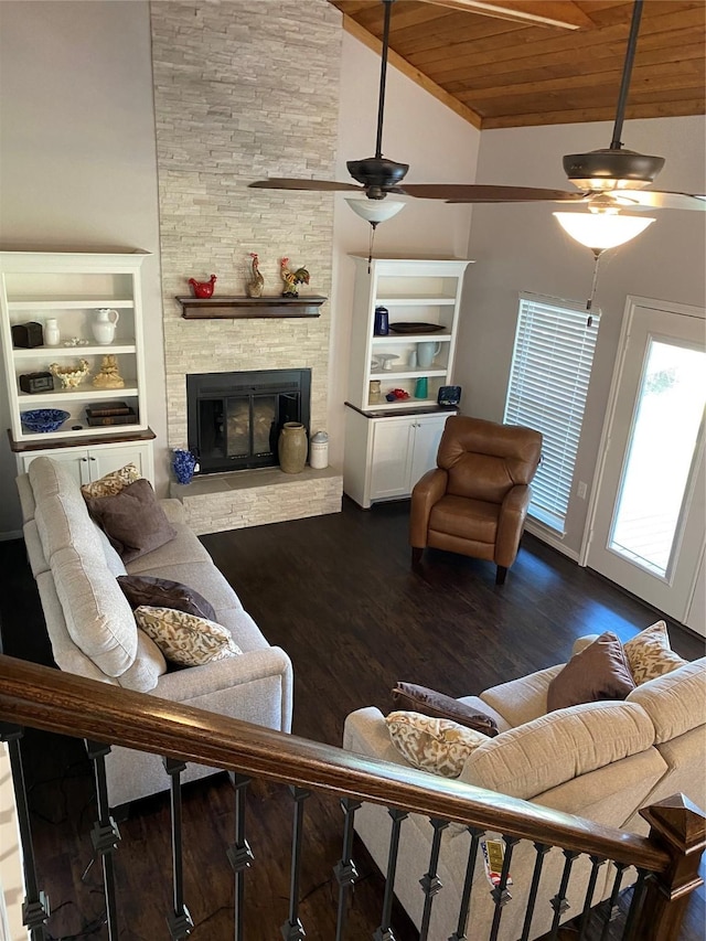 living room with a stone fireplace, wood ceiling, high vaulted ceiling, dark hardwood / wood-style floors, and ceiling fan