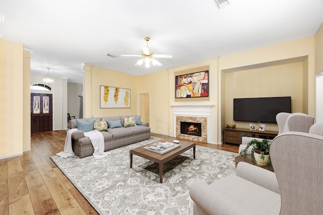 living room featuring ceiling fan and wood-type flooring