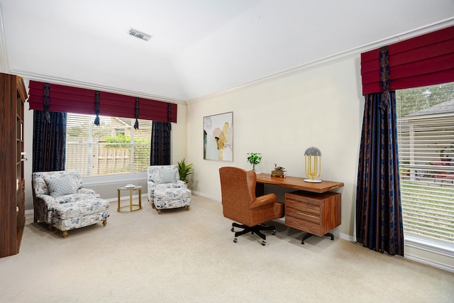 carpeted home office featuring lofted ceiling and crown molding