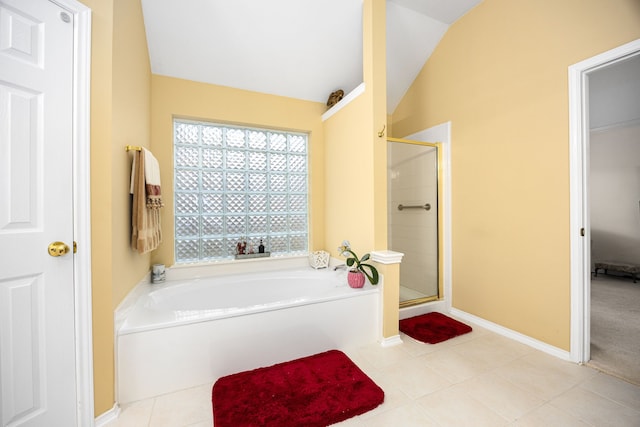 bathroom featuring vaulted ceiling, plus walk in shower, and tile patterned floors