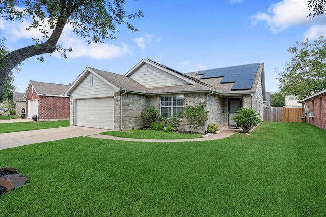 ranch-style house featuring a garage, a front lawn, and solar panels