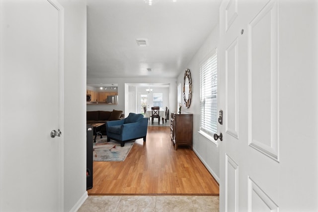 foyer with light wood-type flooring