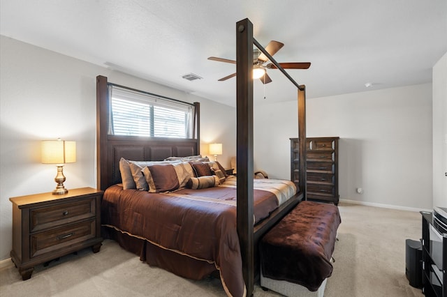 bedroom featuring light carpet and ceiling fan