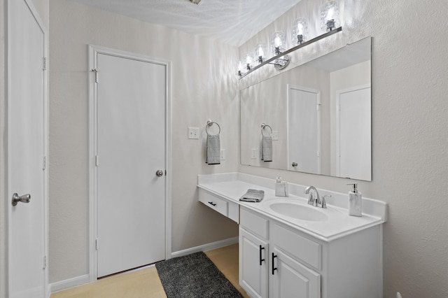 bathroom featuring vanity and a textured ceiling