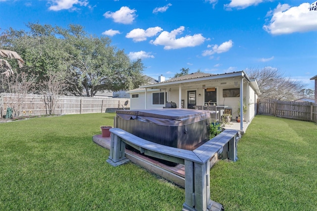 view of yard featuring a hot tub and a patio