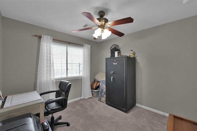 office with light carpet and ceiling fan