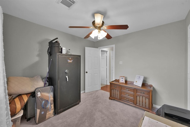 interior space with ceiling fan