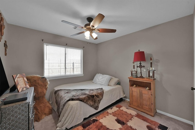 bedroom featuring ceiling fan and light colored carpet