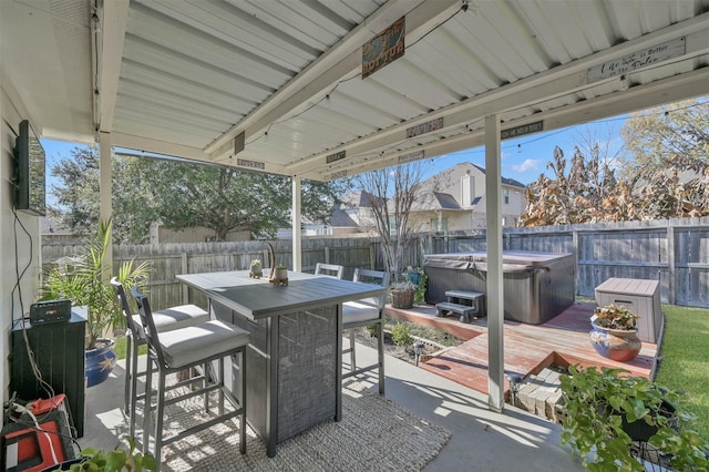 view of patio featuring a hot tub and a wooden deck