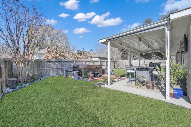 view of yard with a hot tub, an outdoor bar, and a patio