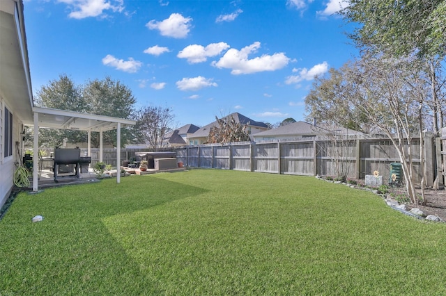 view of yard featuring a patio area and a hot tub