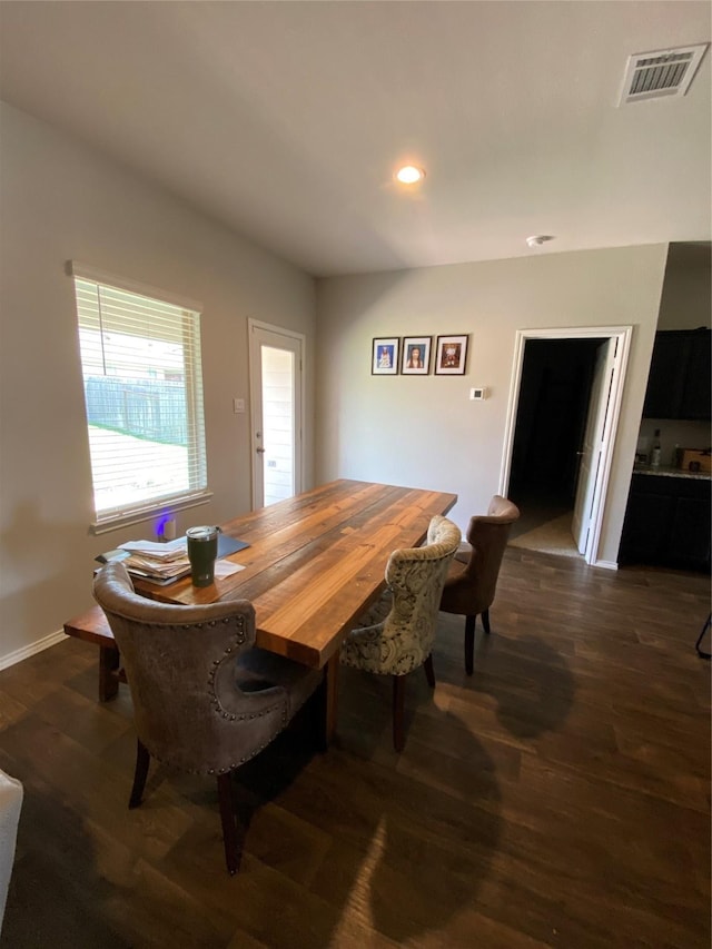 dining room with dark hardwood / wood-style flooring