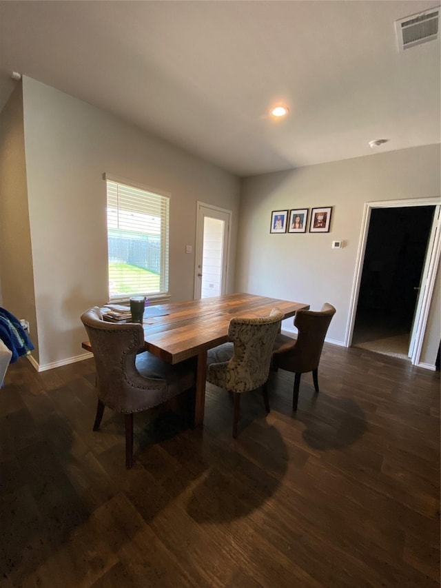 dining area featuring dark hardwood / wood-style floors