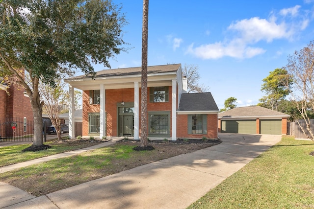 view of front of house with a garage and a front lawn