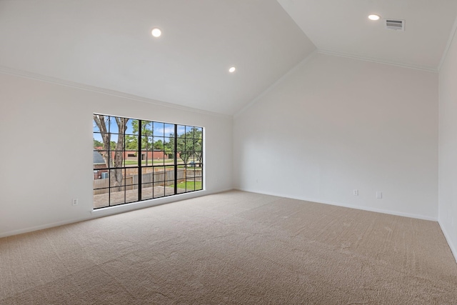 spare room with crown molding, high vaulted ceiling, and carpet