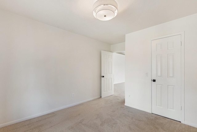 unfurnished bedroom with light colored carpet