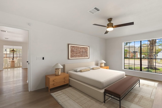 bedroom featuring light hardwood / wood-style floors and ceiling fan