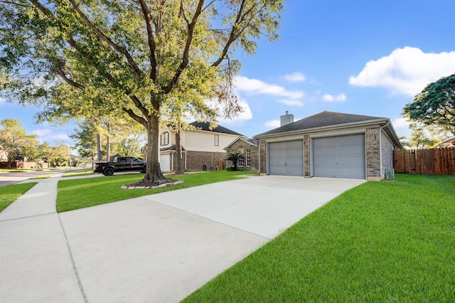 view of front facade featuring a garage and a front lawn