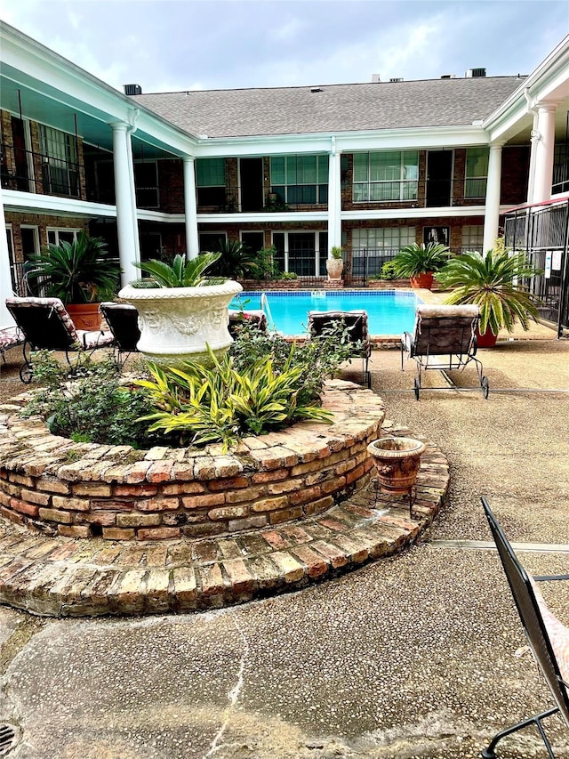 pool with a patio