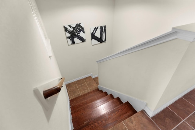 staircase featuring tile patterned floors